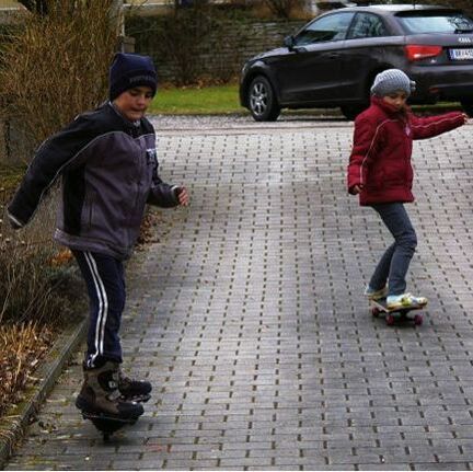Two people skateboarding image